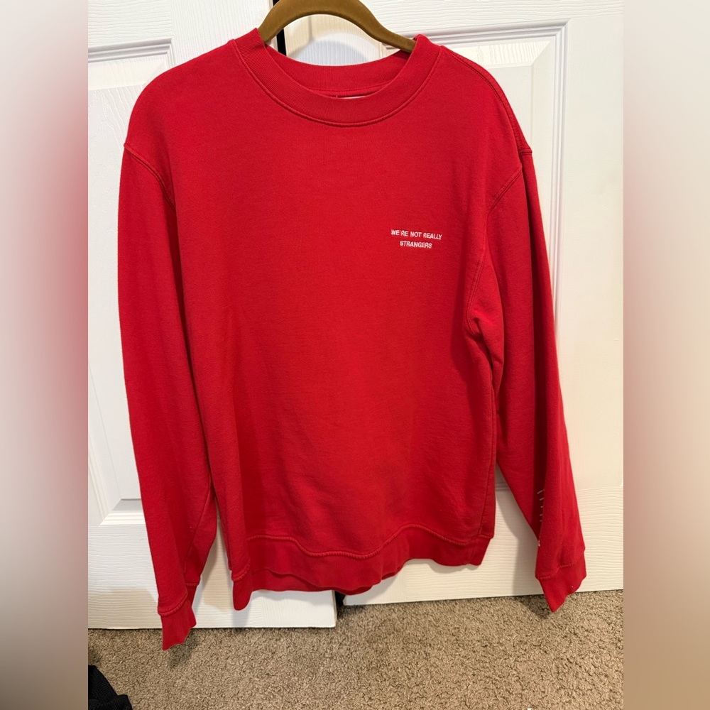 We’re not really strangers Red Graphic Sweatshirt